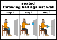 seated throwing ball against wall